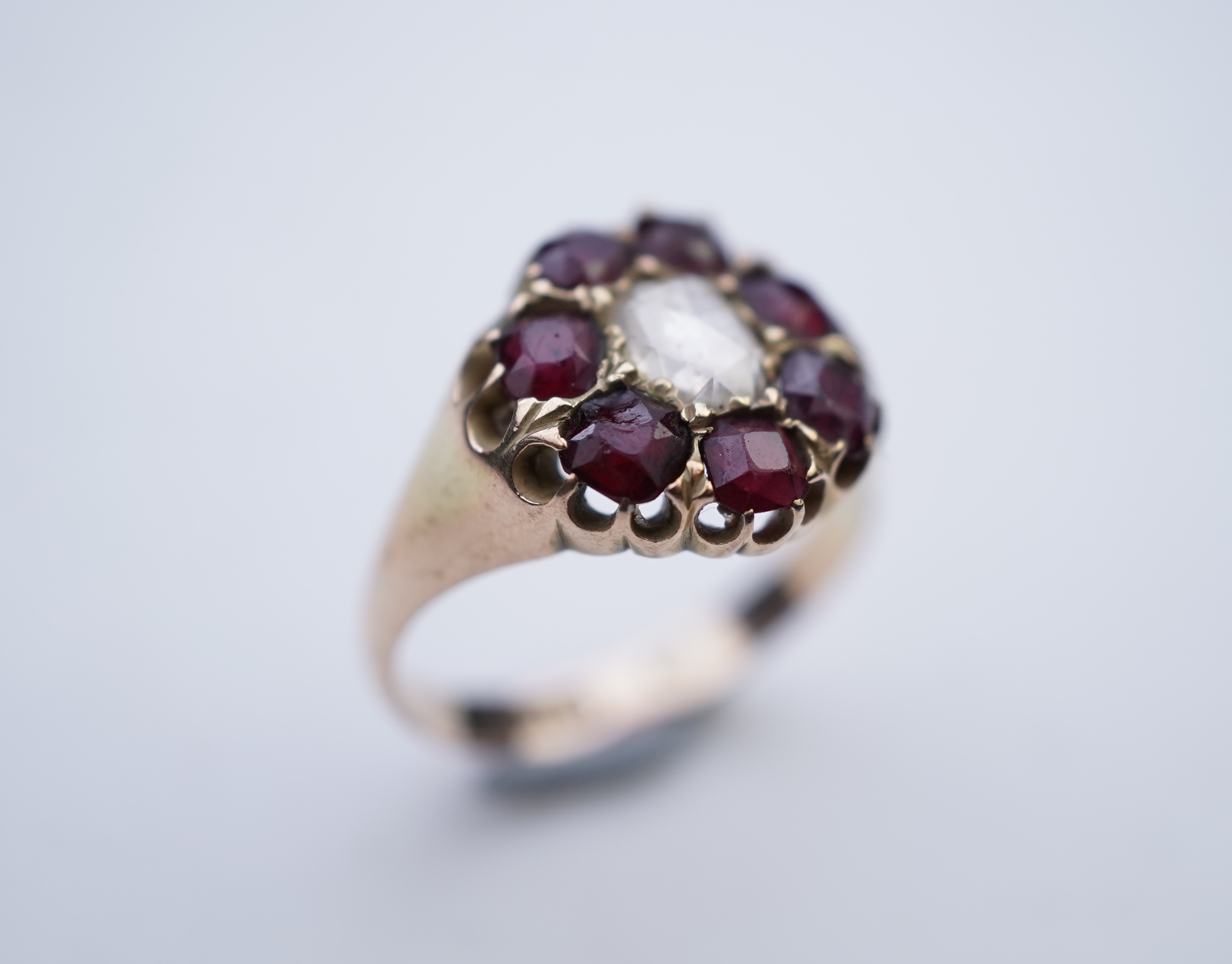 A garnet and diamond ring, late 19th century